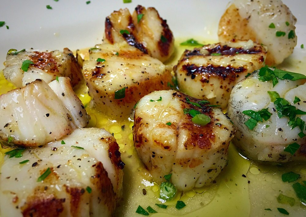 Seared sea scallops in olive oil and herbs at Astoria Seafood